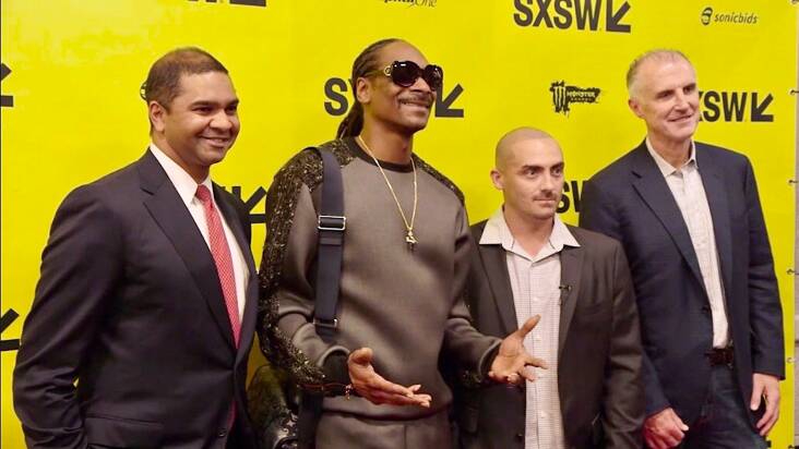 Angelos, third from left, with Snoop Dogg, second from left, along with two Koch Industries executives.